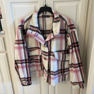 A super warm shacket!  Light purple, orange, and black. Pretty heavy weight.